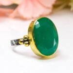 Silver jade ring with oval green gemstone
