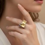 22K gold garnet ring with faceted garnet and sterling silver